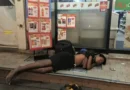 A boy sleeps outside a 7-Eleven store near Siam Square in central Bangkok where he begs most evenings. Tibor Krausz